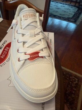 Skechers women’s White Canvas Sneakers with Rose Gold Accents